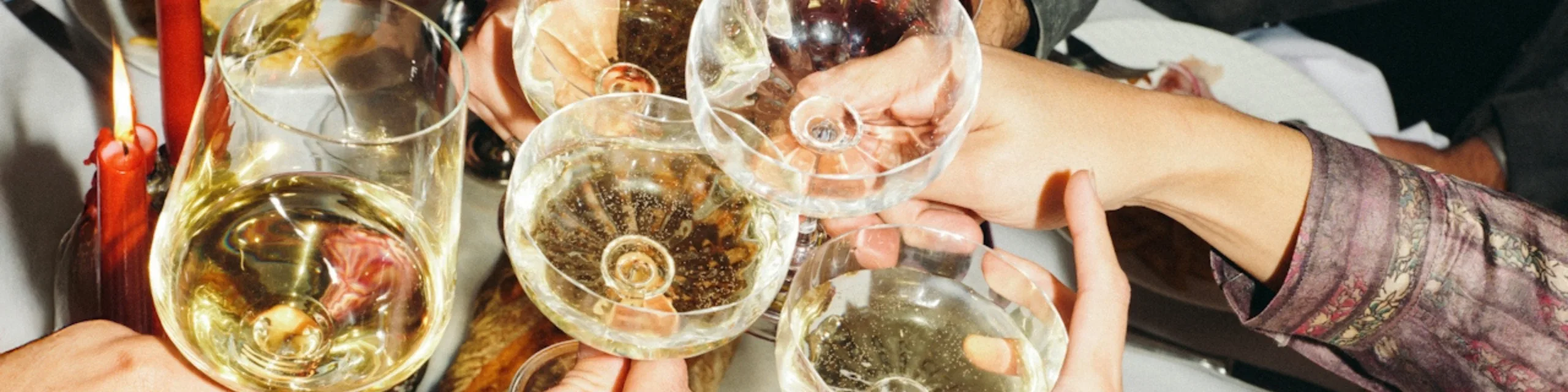 Hands toasting with champagne glasses